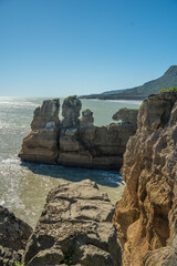 Iconic Pancake Rocks at Punakaiki, West Coast, New Zealand. Towering limestone formations sculpted...