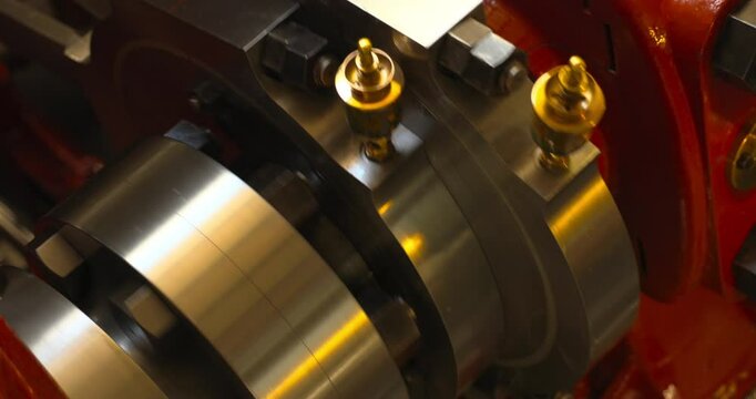 Active Steam Engine Aboard Ship with Red Machinery