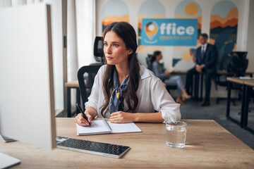 Professional Woman Working in a Modern Office Environment