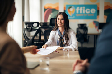 Business Woman Engaging in Professional Meeting at Modern Office Desk