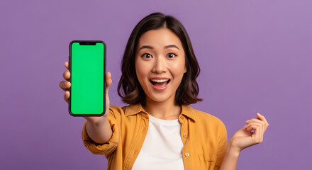 Excited Asian Woman Showing Smartphone Green Screen Mockup