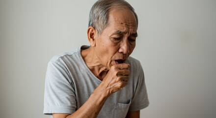 Elderly man experiencing a coughing fit, clutching his throat, showing signs of respiratory distress.