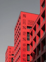 Modern Red Apartment Building with Geometric Facade Design