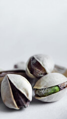 Cracked Pistachios Highlighting Unique Kernel Texture on a Soft Light Background