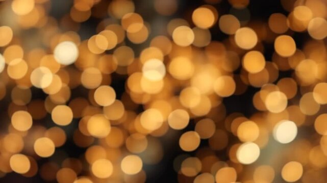 Golden Bokeh Lights Abstract Background of Warm, Shimmering Circles Perfect for Festive Designs and Holiday Projects