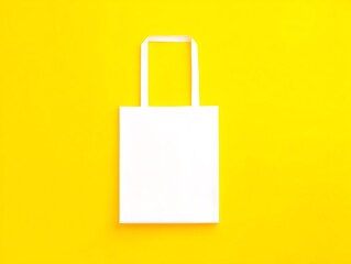 Blank white tote bag on yellow background (1)