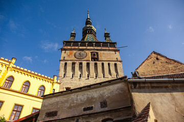 Obraz premium Clock Tower in Historic Sighisoara, Mures County, Romania – Medieval Landmark and Cultural Heritage 