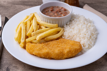 Milanese chicken breast, rice, beans and french fries. Typical brazilian executive dish