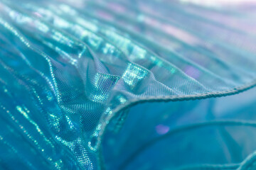 Translucent turquoise fabric with shimmering edges, softly flowing and glowing ethereally, ideal...