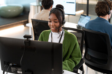Smiling African American woman working customer support operator with headset. Female Call center agent, consulting and telemarketing concept, Customer service representative. online consultant.