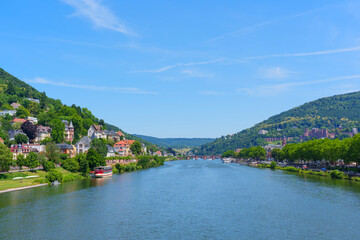 Fototapeta premium River Neckar View with Heidelberg's Riverside Homes and Hills
