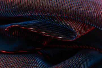 Blue and Red Textured Fabric – Close-Up of Patterned Textile with Dotted Design and Folds for...