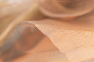 Delicate Beige Fabric Texture with Soft Flowing Folds – Ideal for Fashion Design, Textile...