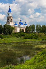 Kashin, Tver region, Russia - 9 July 2021: Scenic cityscape Kashin town in summer, Resurrection Cathedral on bank of the Kashinka River
