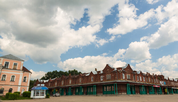 Kashin, Tver region, Russia - 9 July 2021: Ancient building of shopping arcades on a sunny summer day