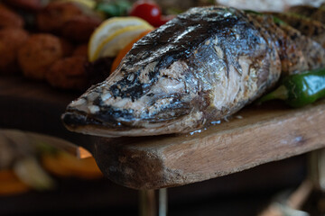 Close-up fried pike head cooked fish crispy golden delicious fresh meal seafood