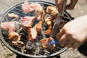 cooking Meat on the grill, barbecue concept, picnic, outdoor catering