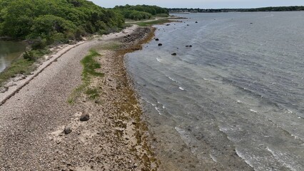 Aerial peaceful Massachusetts coastline with natural islands with beach and trees wildlife preserve in Buzzards Bay beautiful shoreline near Boston