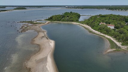 Aerial peaceful Massachusetts coastline with natural islands with beach and trees wildlife preserve...