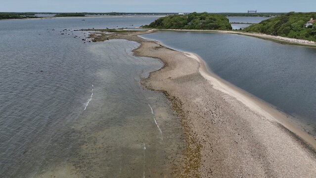 Aerial peaceful Massachusetts coastline with natural islands with beach and trees wildlife preserve in Buzzards Bay beautiful shoreline near Boston