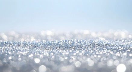 Glittering silver bokeh background with sparkling light highlights