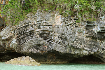 Incredible Pancake rock called Khao Hin Phap Pha, natural rock formation of layered rock with a...