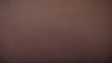 Fototapeta premium Plain dark brown textured background with a subtle gradient, offering a versatile and earthy backdrop