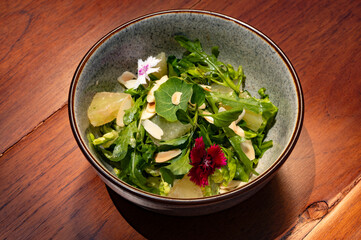 Refreshing Grapefruit and Arugula Salad with Almonds and Edible Flowers A Culinary Delight