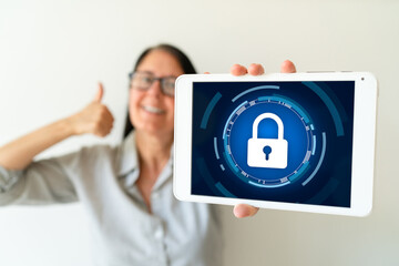 Caucasian woman holding a tablet with a lock on the screen. Concept of good privacy policies.