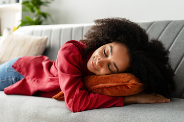 Woman Relaxing on Couch with Pillow
