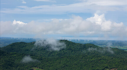 Green hill top in clouds