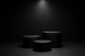 Three sleek black cylinders stand as a product display podium against a dark backdrop