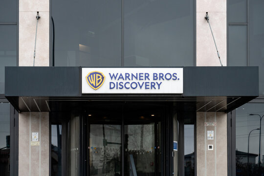 Warner Bros. Discovery logo sign. Polish branch of the American mass media conglomerate. Warner Bros. Entertainment Poland logotype on office at Wiertnicza street on March 24, 2025 in Warsaw, Poland.