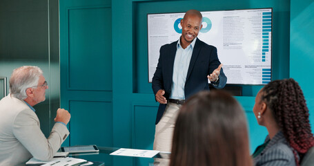 Man, presentation and happy at meeting with charts, discussion or review at finance agency. Person, speaker and operations manager by monitor for feedback, stats and solution for company efficiency