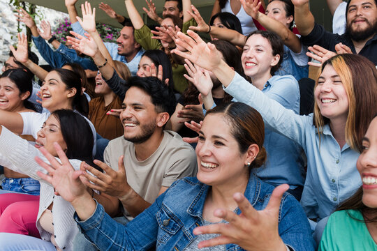 Diverse group of latin people applauding after successful conference in convention center in Mexico in Latin America, hispanic friends clapping in social meeting - Powered by Adobe