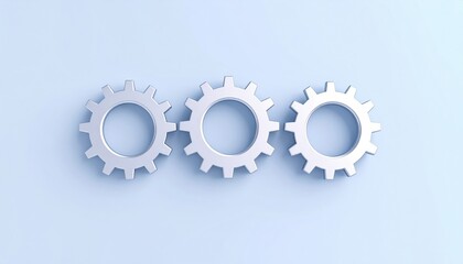 Three Interlocking Silver Gears On Light Blue Background