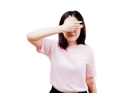 Asian young beautiful woman in a light pink shirt covers her eyes with her hand, standing facing forward with straight black hair.