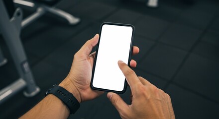Man Using Smartphone with Blank Screen in Gym