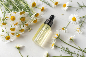 Therapeutic chamomile oil in a dropper bottle, evoking a sense of calm and natural purity.