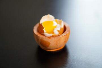One half boiled egg that has been opened