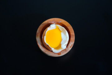 One half boiled egg that has been opened