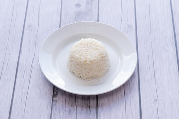 Steamed rice on white disc