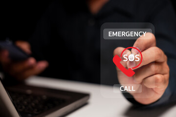A person interacts with a digital interface displaying an SOS emergency call icon, symbolizing...