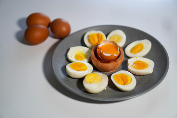 Various levels of doneness of boiled eggs with 3 whole eggs