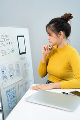 UI UX designer drawing new website wireframe.