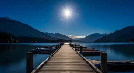 Obraz premium Illuminated Dock Leading to a Full Moonlit Lake at Night, A Bright Moon Shimmers Over Calm Water with Silhouetted Mountains, The Pier's Lights Create a Golden Path Towards the Horizon.