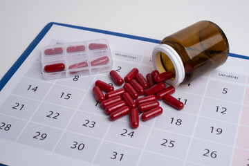 Measuring tape and tablets, vitamins on a light background with space for text. Concept of losing...