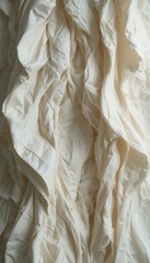 Obraz premium Intricate fabric folds create elegant creamy beige textile backdrop