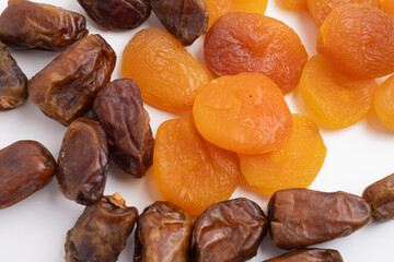 Dried fruits dried apricots and dates on a light background. Healthy snack

