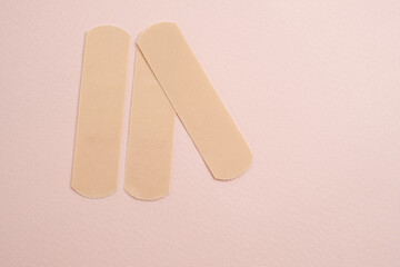 Set of medical plasters on a light background. Health concept. First aid for cuts